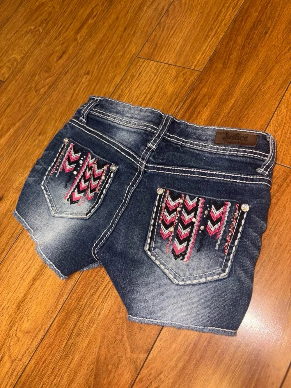 Y2K Justice navy blue denim shorts with pink and black chevron embroidery